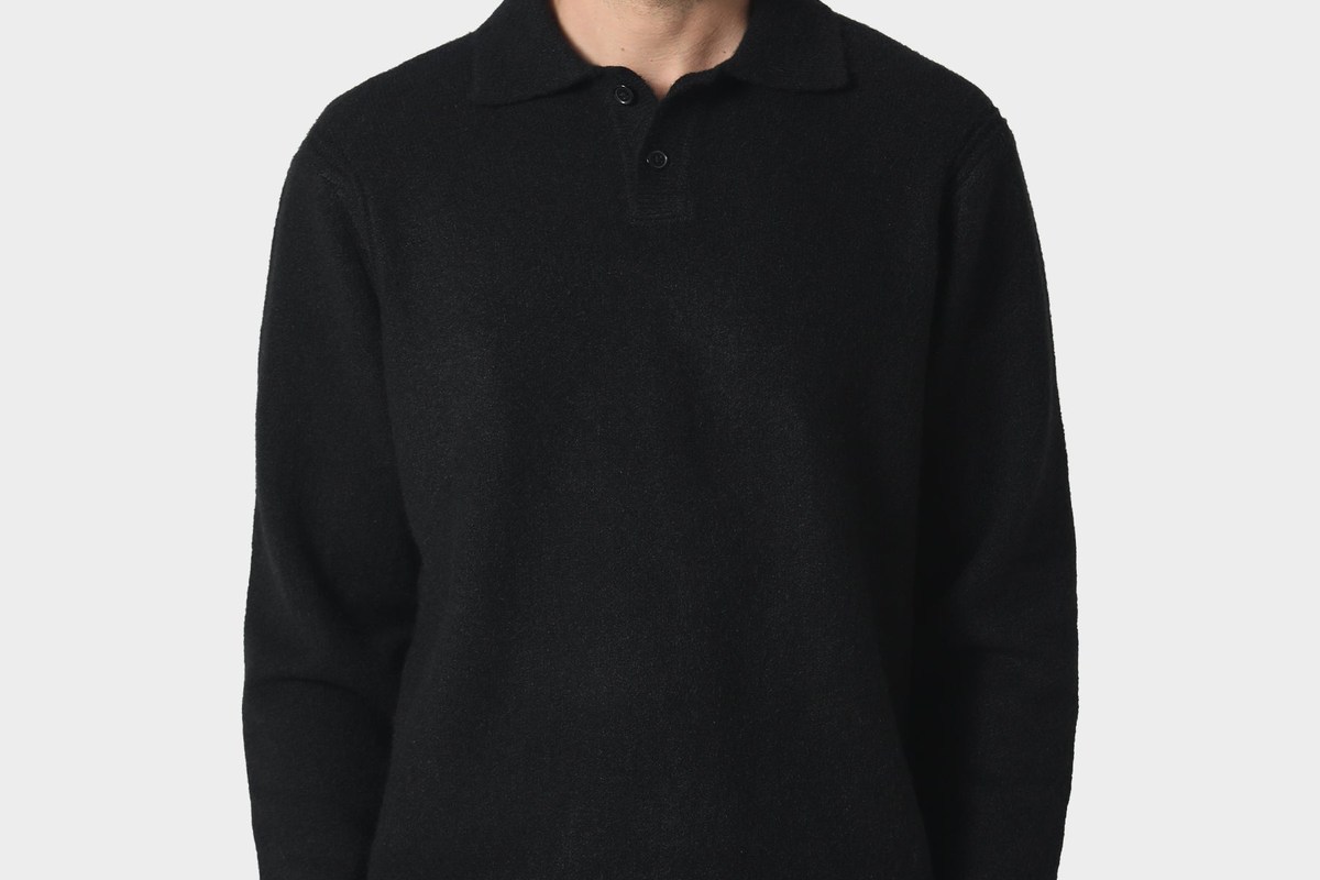 Black SEDLEY knit polo styled with black trousers